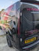 Smoked LED rear light unit fitted to a black Ford Transit Custom