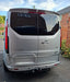 Rear view of a silver Ford Transit Custom with smoked LED rear light units fitted