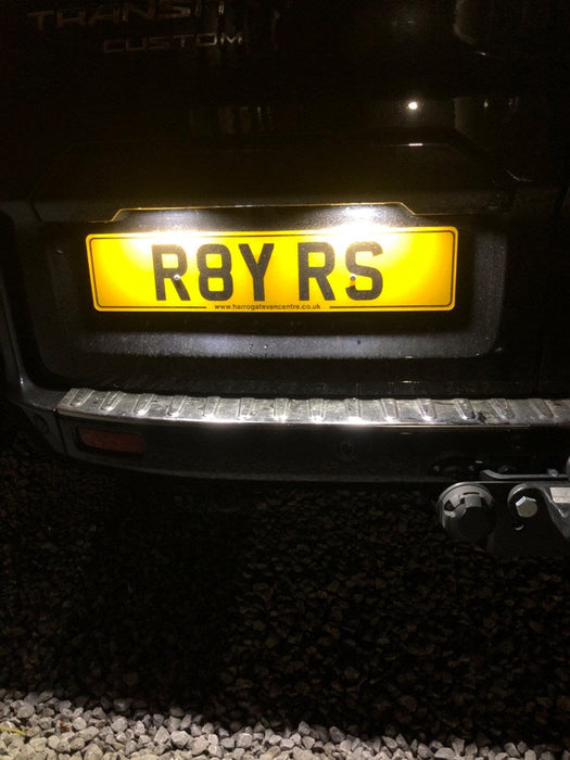 Ford Transit Custom rear registration plate illuminated by white LED number plate lights at night