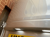 Close-up of two white LED number plate lights installed above a rear plate
